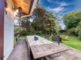 A dining area with table and chairs at Hatepe Lake Taupo Retreat Lake Taupo