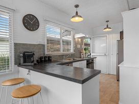 A kitchen with counter and appliances at Taupo - Holiday Home