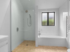 A bathroom featuring a bathtub and a shower at Omaha in Omaha