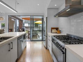 A kitchen with a stove and outdoor view at Omaha in Omaha