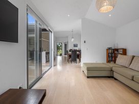 A living room with a sofa and television at Omaha in Omaha