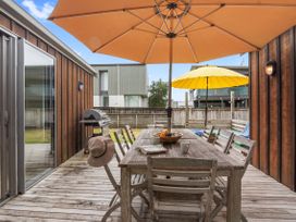 An outdoor dining area with a table and chairs at White Sands Haven - Omaha