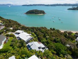An aerial view of water and an island with boats at Paihia in Paihia