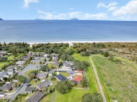 An aerial view of residential area near the ocean at Ruakaka Coastal Reserve Retreat in Ruakaka