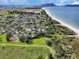 Aerial view of a residential area near the beach at Ruakaka Coastal Reserve Retreat in Ruakaka