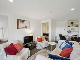 A living room with sofa and television at Wanaka Holiday Home in Wanaka