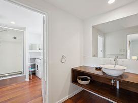 A bathroom with a sink and shower at Wanaka Holiday Home in Wanaka