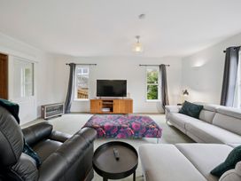 A living room with a television and seating at Khandallah Stays - Wellington Holiday home Wellington