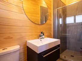 A bathroom with a sink and shower at Ohakune Holiday Home in Ohakune