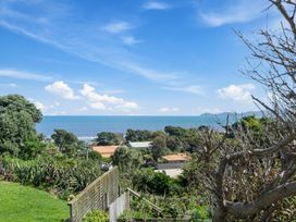 A view of the ocean and sky from a hillside at Ocean Breeze Cottage - Paekakariki Holiday Home