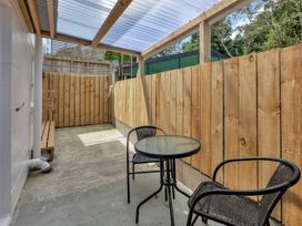 An outdoor area with a table and chairs at Whangarei