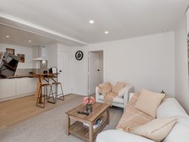 A living room with a sofa and a coffee table at Whangarei