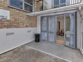 An entrance with a door and curtains at Whangarei in Whangarei