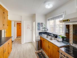 A kitchen with sinks and cabinets at Napier in Napier