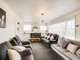 A living room with seating and a fireplace at Napier in Napier