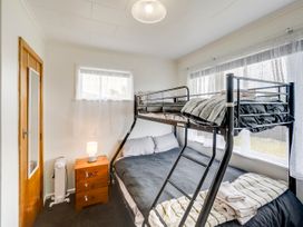 A bedroom with a bunk bed and a nightstand at Napier in Napier