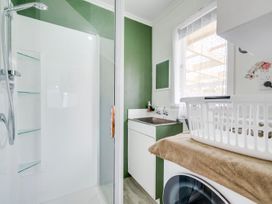 A laundry room with a shower and sink at Napier in Napier