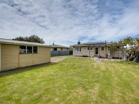 An outdoor view of a house with a garden and shed at Napier in Napier