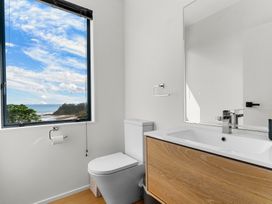 A bathroom with a sink and toilet at Langscape - Langs Beach Holiday Home Langs Beach