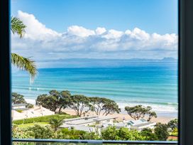 A view of the ocean with clouds and trees at Langscape - Langs Beach Holiday Home in Langs Beach
