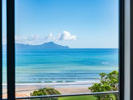 A view of the ocean and mountains at Langscape - Langs Beach Holiday Home in Langs Beach