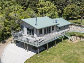A house with a deck and stairs at Picton in Picton