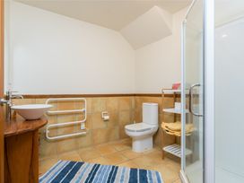 A bathroom with a shower and sink at Ruakaka