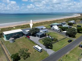 An aerial view of a beach house and surrounding area at Karikari in Kaitaia