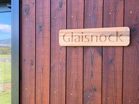 A wooden sign on a wooden wall at Glaisnock Hut - Te Anau Holiday Home in Te Anau
