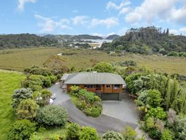 An aerial view of a house surrounded by greenery at Matapouri Holiday Home in Whangarei