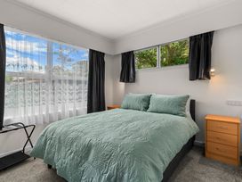 A bedroom with a bed and window at Amanda Lane - Snells Beach Holiday Home Snells Beach