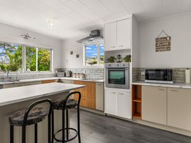 A kitchen with an oven and microwave at Amanda Lane - Snells Beach Holiday Home in Snells Beach