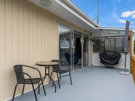 An outdoor area with a table and chairs at Amanda Lane - Snells Beach Holiday Home Snells Beach