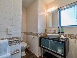 A bathroom featuring a sink and toilet at Lakefront Penthouse - Central Queenstown Holiday Home, Queenstown