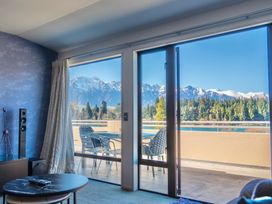 A living room with mountain views at Lakefront Penthouse - Central Queenstown Holiday Home Queenstown