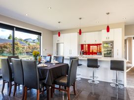 A dining area with a table and chairs at Lake Hawea Holiday Home in Wanaka