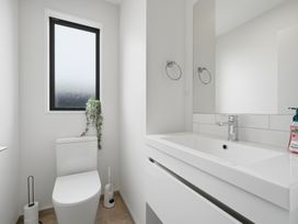 A bathroom with a sink and toilet at Bliss at Madras - Christchurch Holiday Home