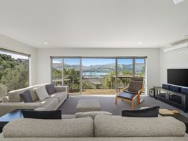 A living room with a view of the landscape at Lyttelton Holiday Home in Lyttelton