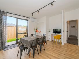 A dining room with a table and chairs at Sun and Sea Sanctuary - Whitianga