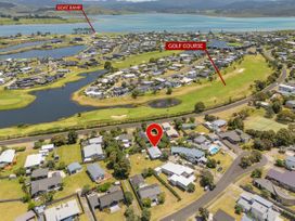 An aerial view of a residential area with a boat ramp and golf course at Whitianga Holiday Home in Whitianga