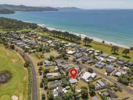 An aerial view of a coastal neighborhood at Whitianga Holiday Home in Whitianga