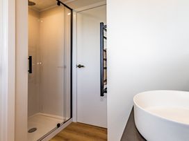 A bathroom with a shower and sink at Ohakune Holiday Home in Ohakune