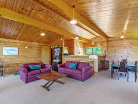 A living room with furniture at Lake Taupo Holiday Home in Turangi