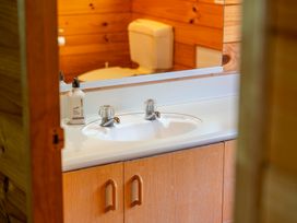 A bathroom with a sink and toilet at Lake Taupo Holiday Home, Turangi