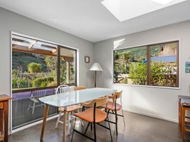 A dining room with a table and chairs at Brook Beauty - Nelson Holiday Home, Nelson