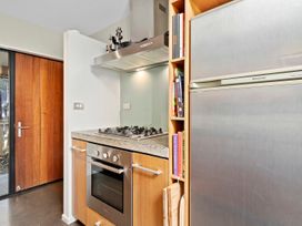 A kitchen with an oven, stove, and refrigerator at Brook Beauty - Nelson Holiday Home, Nelson