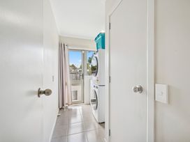 A laundry room with a washing machine and dryer at Martinborough Holiday Home in Martinborough