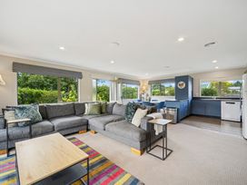 A living room with a sofa and coffee table at Martinborough Holiday Home in Martinborough
