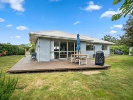 A house with a patio and garden at Martinborough Holiday Home, Martinborough