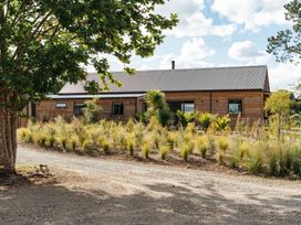 A house with garden and pathway at Mangawhai Heads